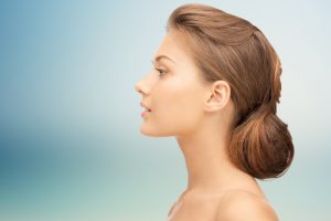 beautiful young woman face over blue background